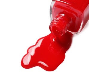 Photo of Spilled color nail polish with bottle on white background