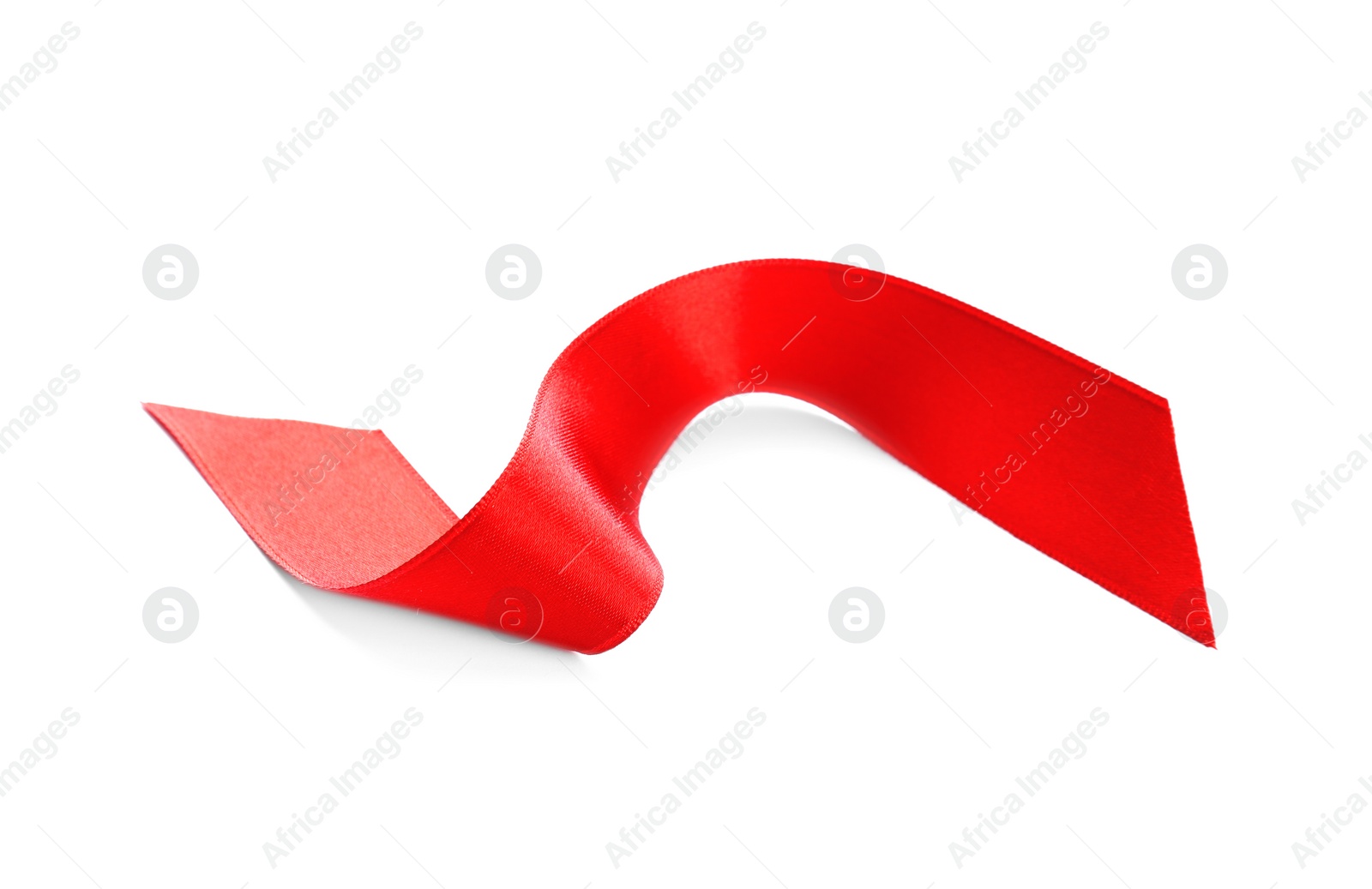 Photo of Simple red ribbon on white background. Festive decoration