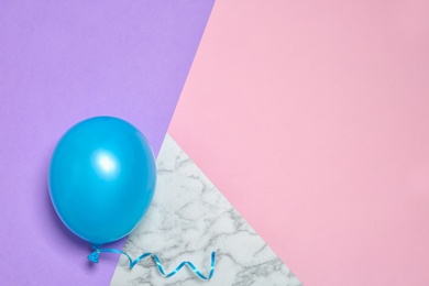 Photo of Bright balloon on colorful background, top view with space for text. Party time