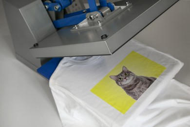 Image of Custom t-shirt. Using heat press to print photo of cute cat