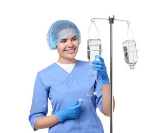 Nurse setting up IV drip on white background
