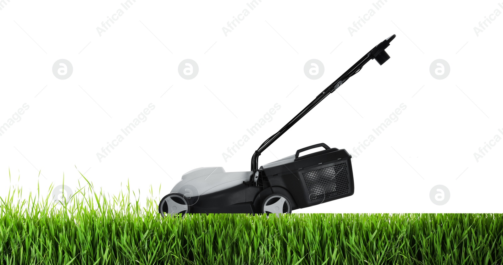 Image of Modern garden lawn mower cutting green grass, white background. Banner design