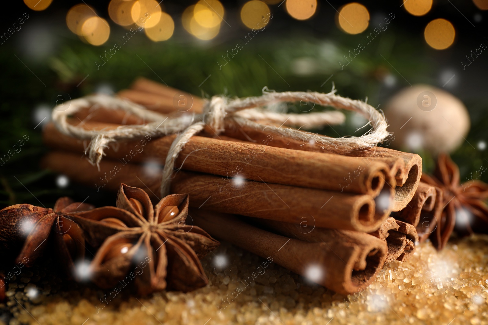 Image of Different spices, closeup. Cinnamon, anise on brown sugar. Bokeh effect