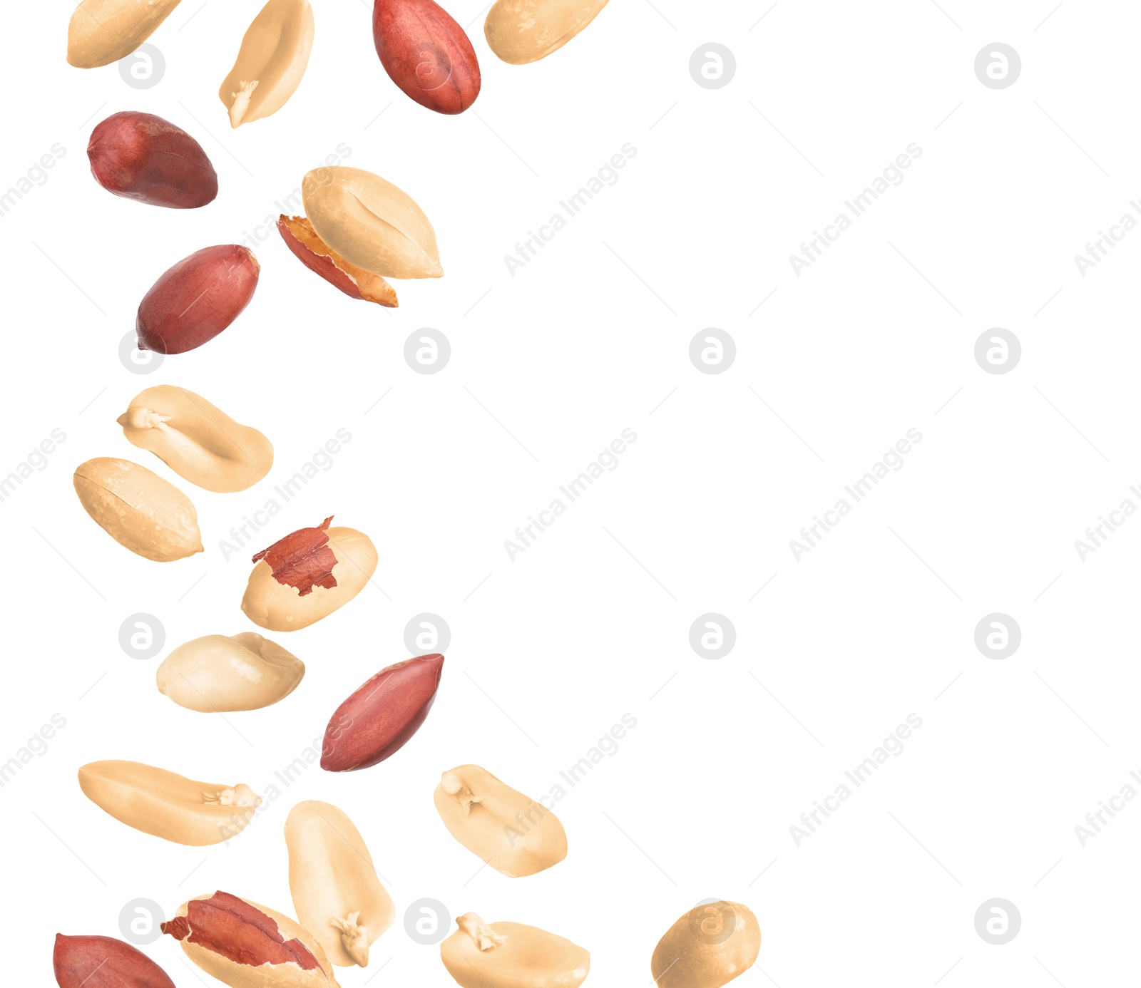 Image of Many peanuts in air on white background