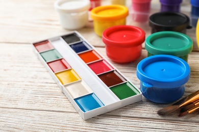 Set of painting materials for child on color table