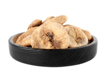 Black wooden plate of dried figs on white background