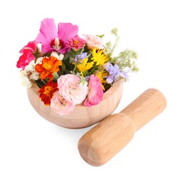 Wooden mortar with different flowers and pestle on white background