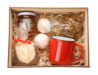 Gift set with cup and different products in box on white background, top view. Stylish present