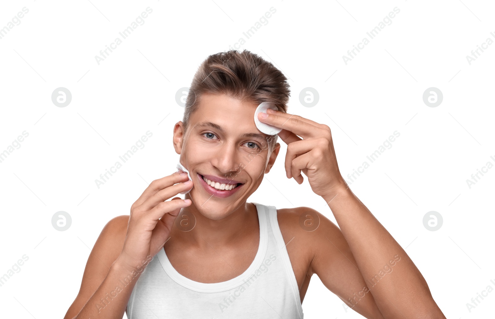 Photo of Handsome man with cotton pads on white background