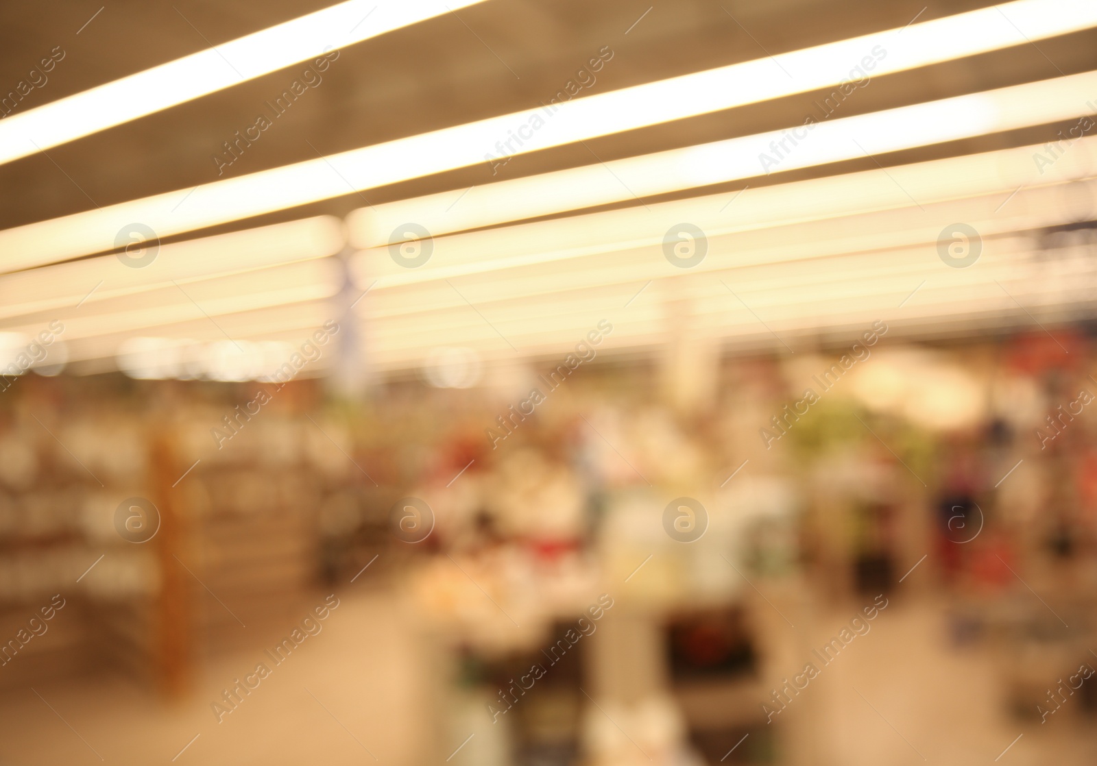 Photo of Blurred view of modern shopping mall interior