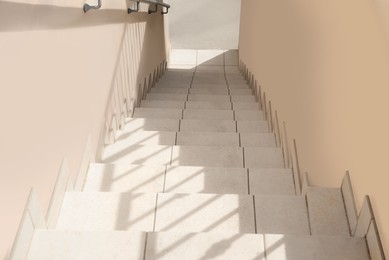 Photo of Staircase leading to exit of house outdoors, above view