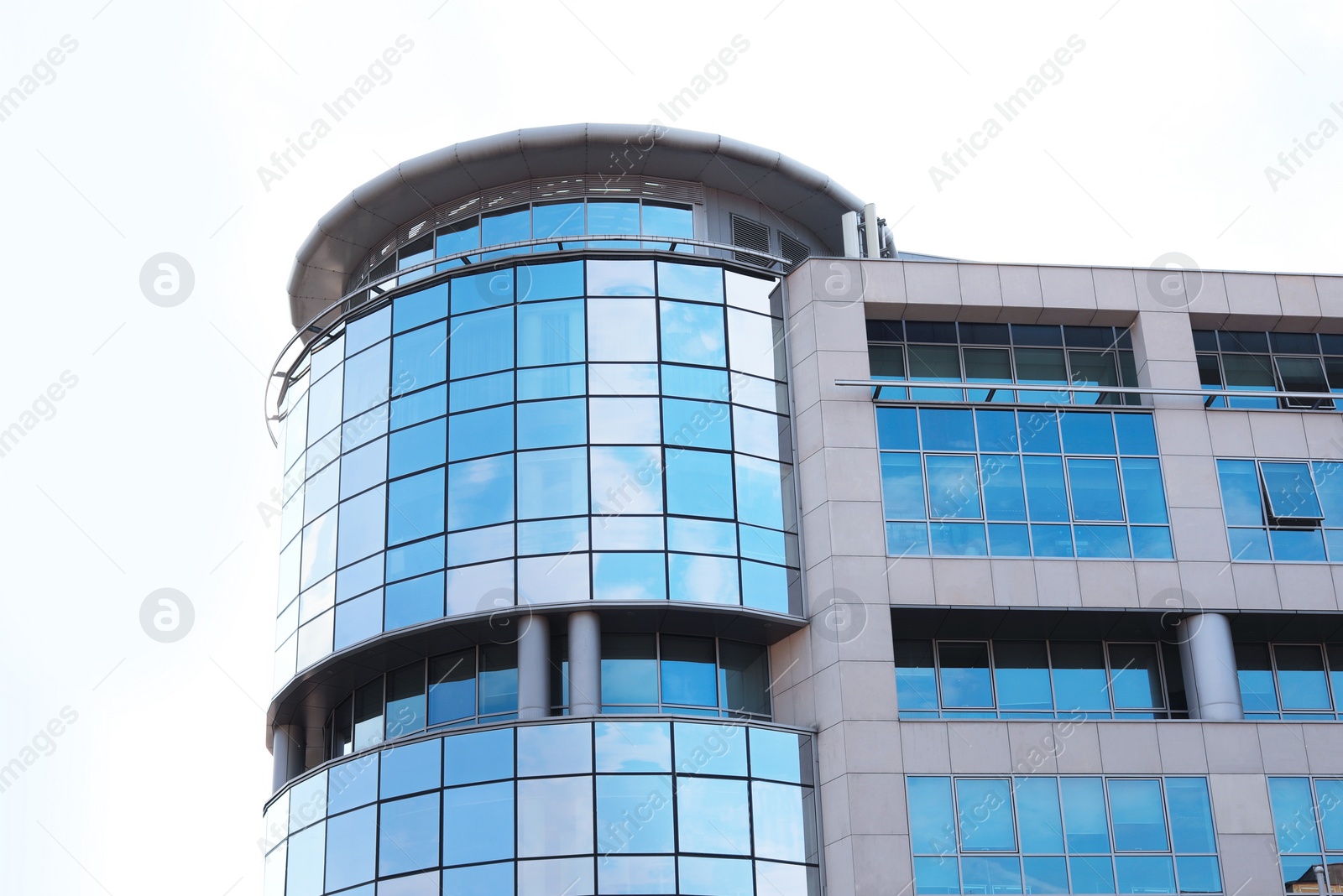 Photo of Building with tinted windows. Modern architectural design