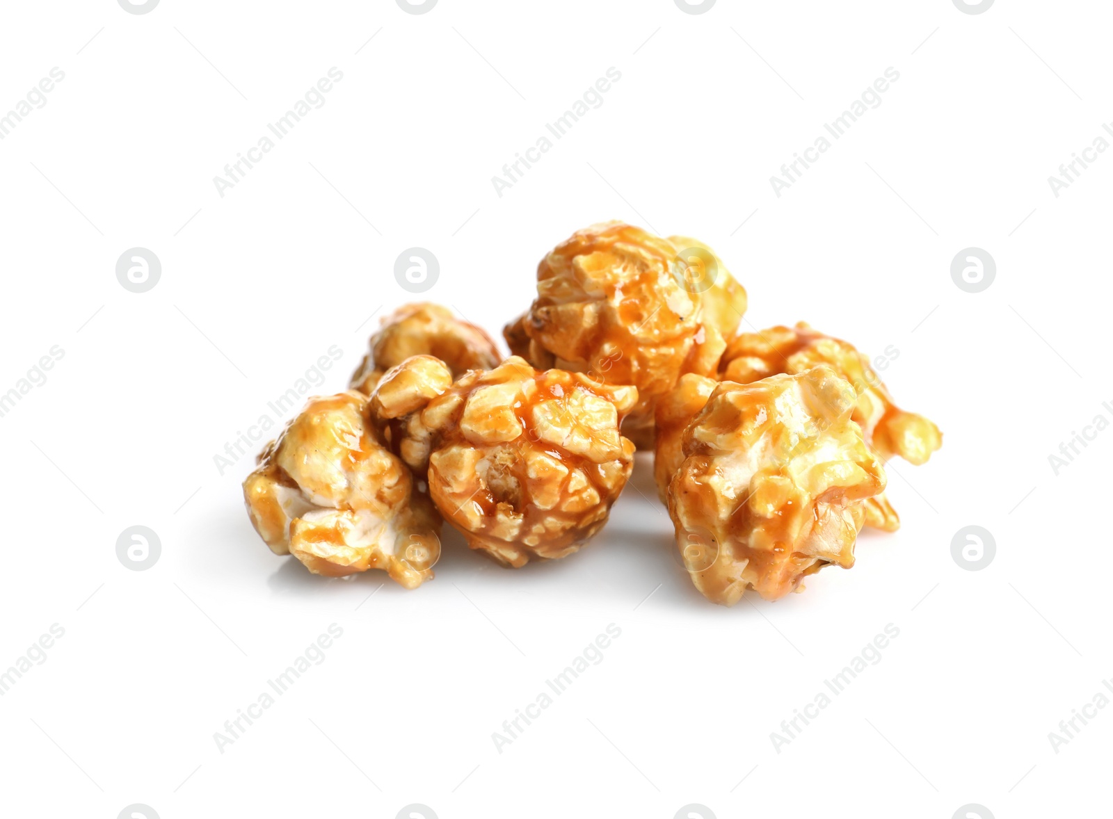 Photo of Delicious popcorn with caramel on white background