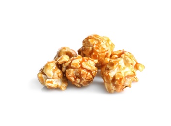 Delicious popcorn with caramel on white background
