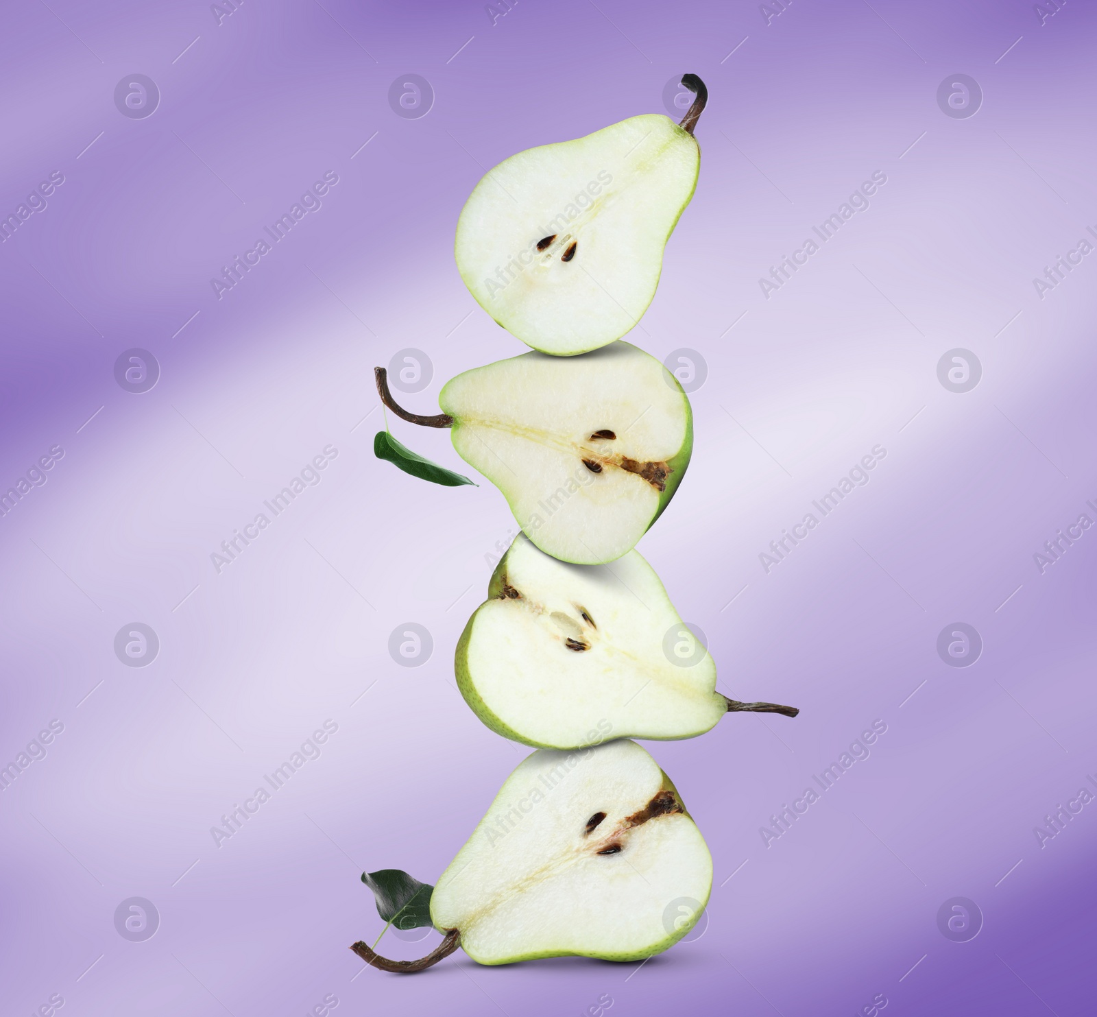 Image of Cut fresh ripe pears on dark violet gradient background