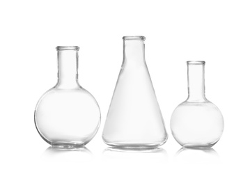 Photo of Group of empty chemistry glassware isolated on white