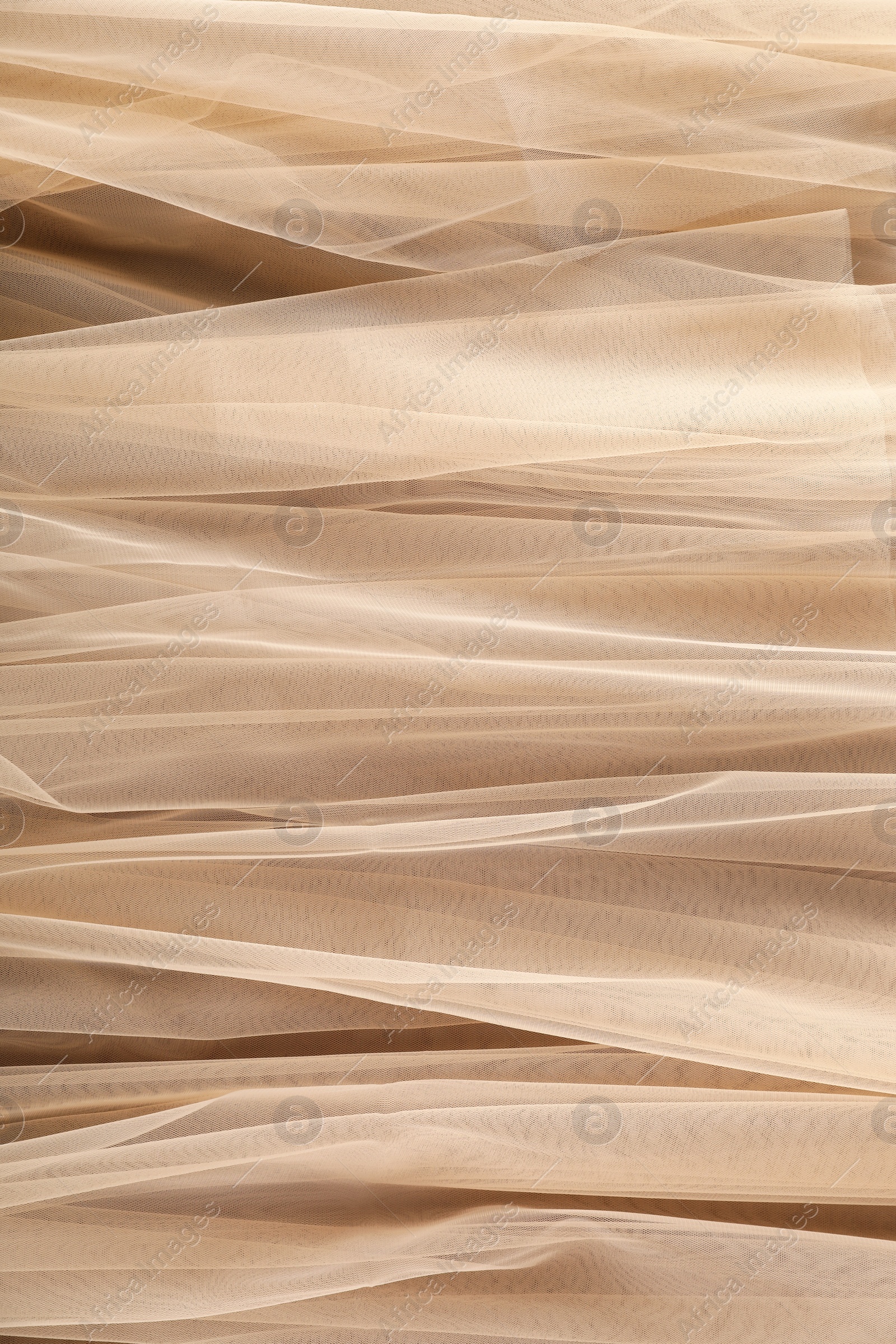 Photo of Beautiful tulle fabric as background, closeup view