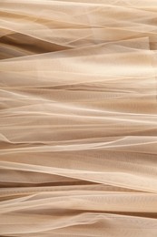 Photo of Beautiful tulle fabric as background, closeup view