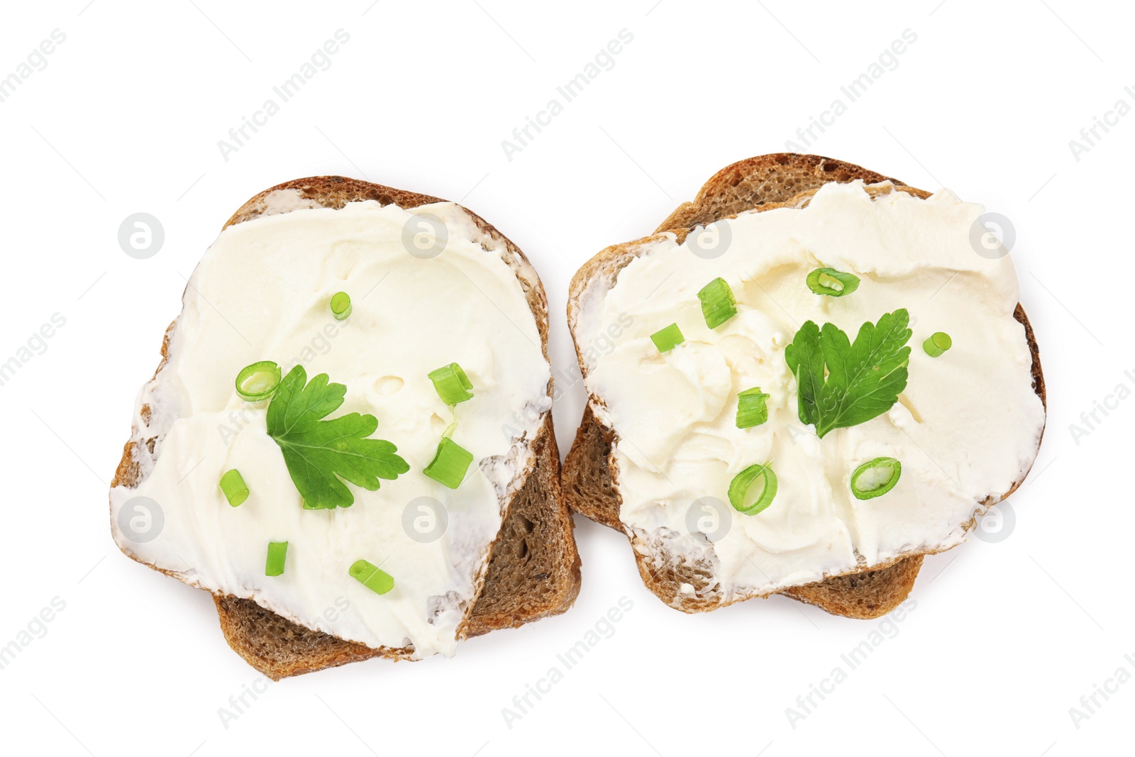 Photo of Bread with cream cheese, green onion and parsley on white background, top view