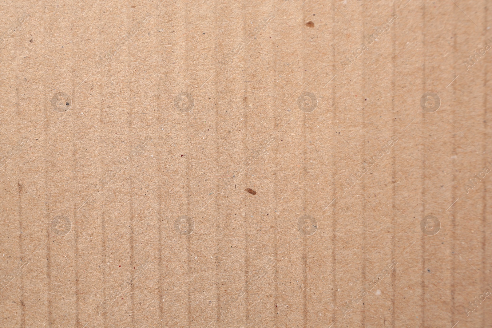 Photo of Texture of beige paper sheet as background, closeup