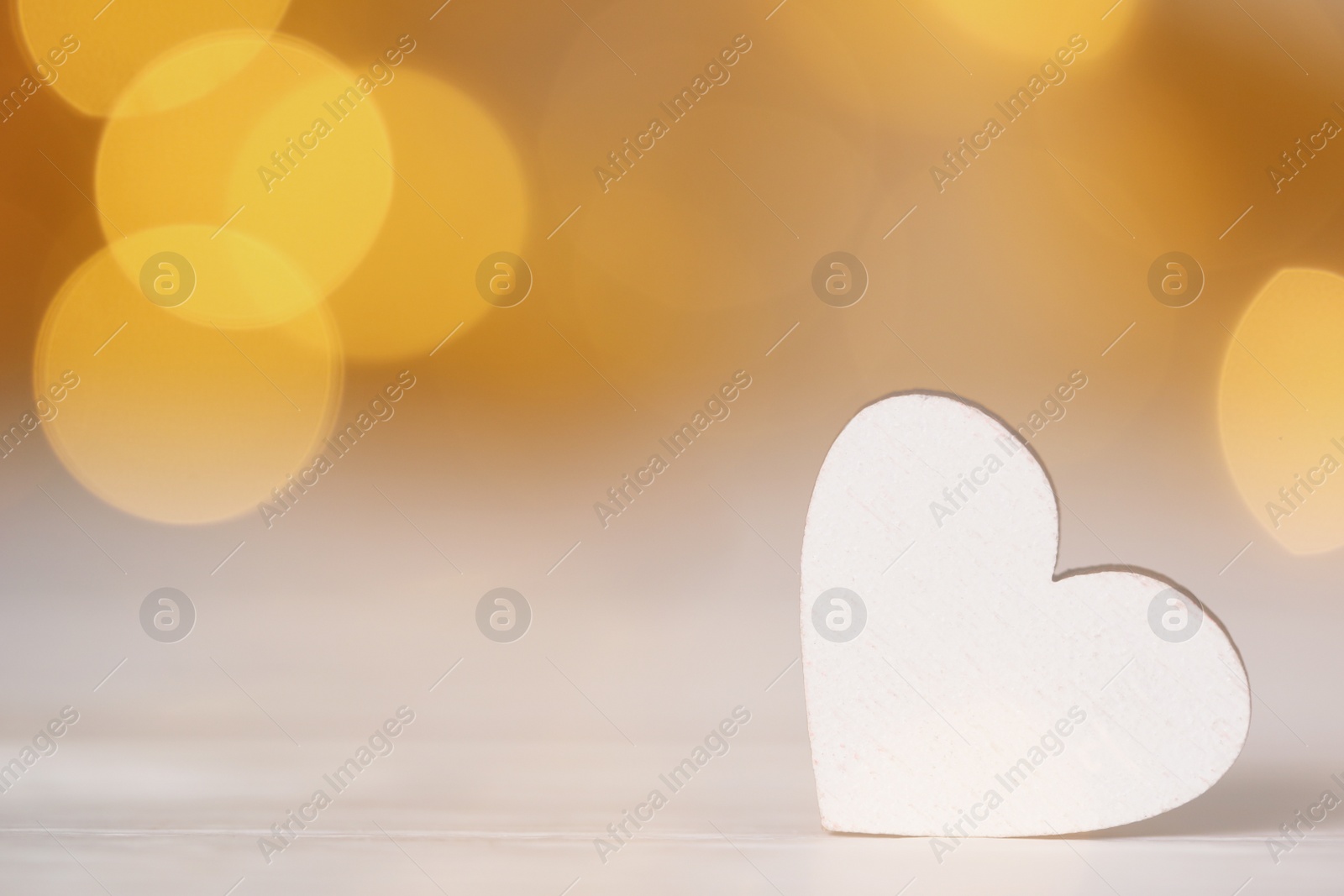 Photo of White decorative heart on table, space for text. Valentine's Day