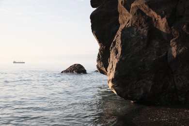 Picturesque view of sea and rocks on sunny day