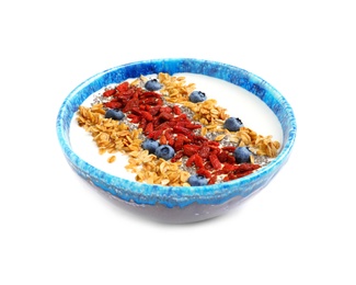 Photo of Smoothie bowl with goji berries on white background