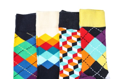 Photo of Colorful socks on white background, top view