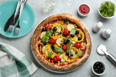 Flat lay composition with vegetable pizza on light grey table