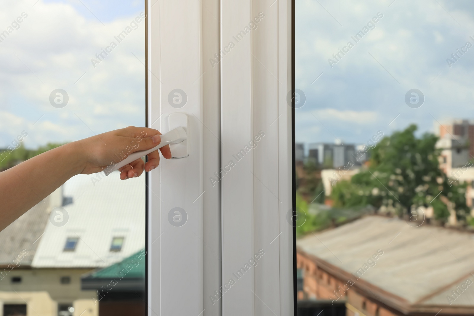 Photo of Woman opening white plastic window indoors, closeup. Space for text