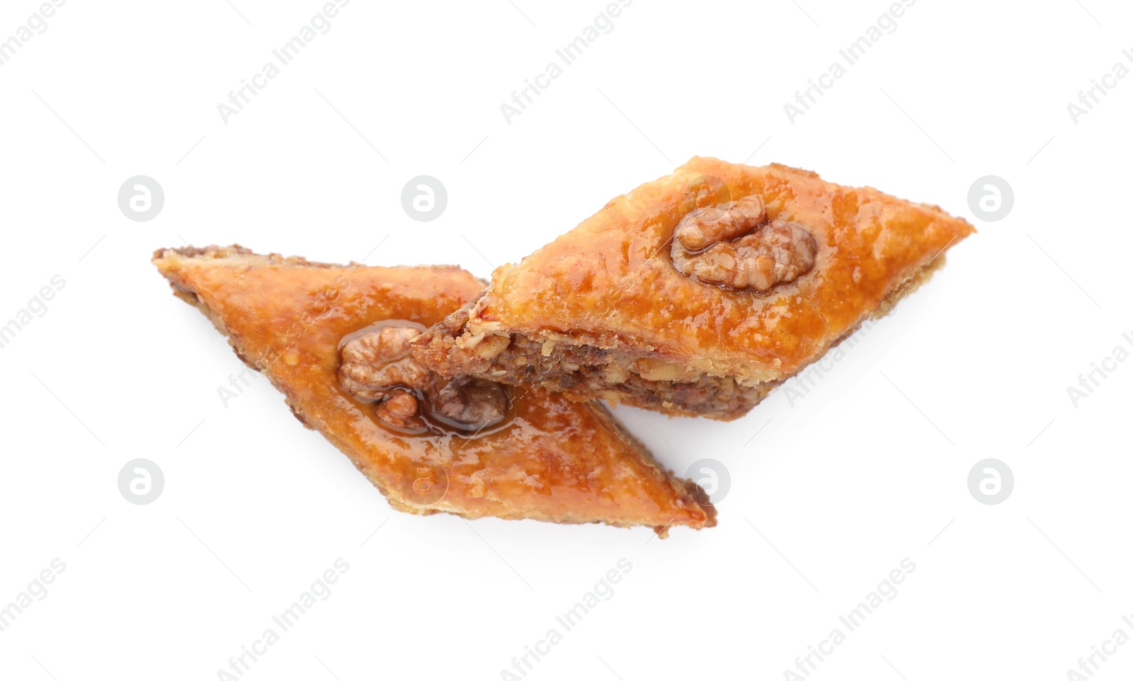 Photo of Delicious honey baklava with walnuts on white background, top view