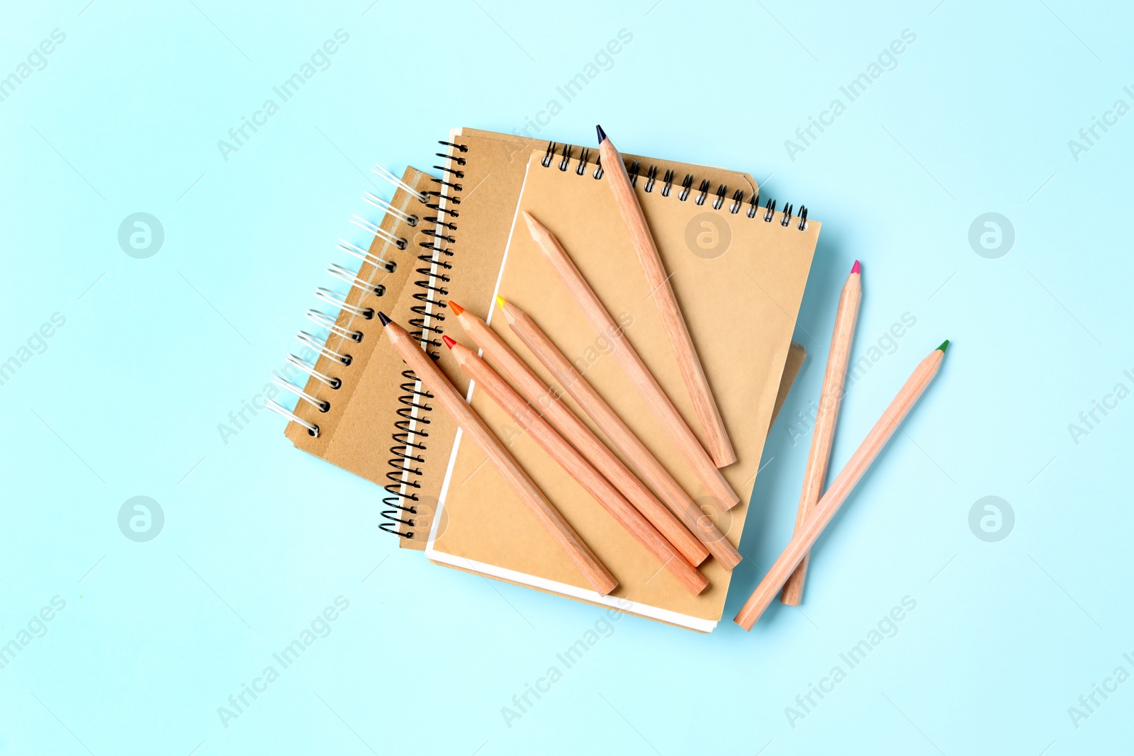 Photo of Different school stationery on light blue background, flat lay. Back to school