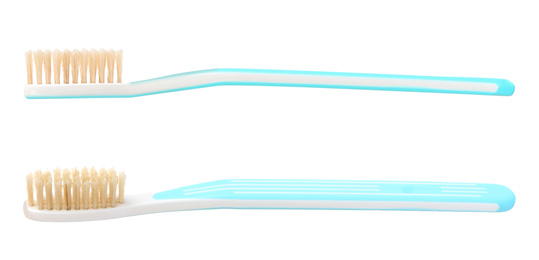 Image of Natural toothbrushes with blue handles on white background 