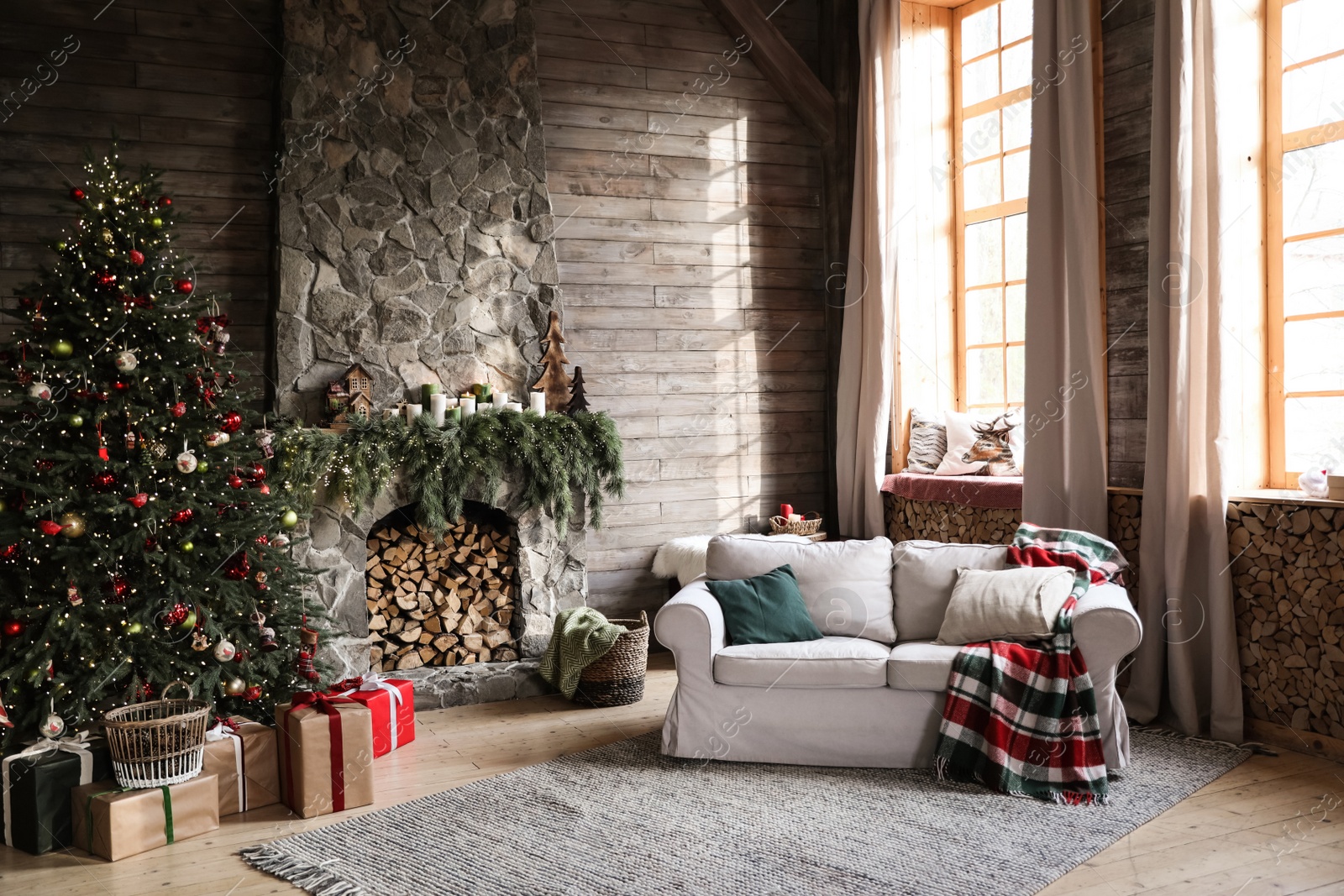 Photo of Festive interior with decorated Christmas tree and fireplace