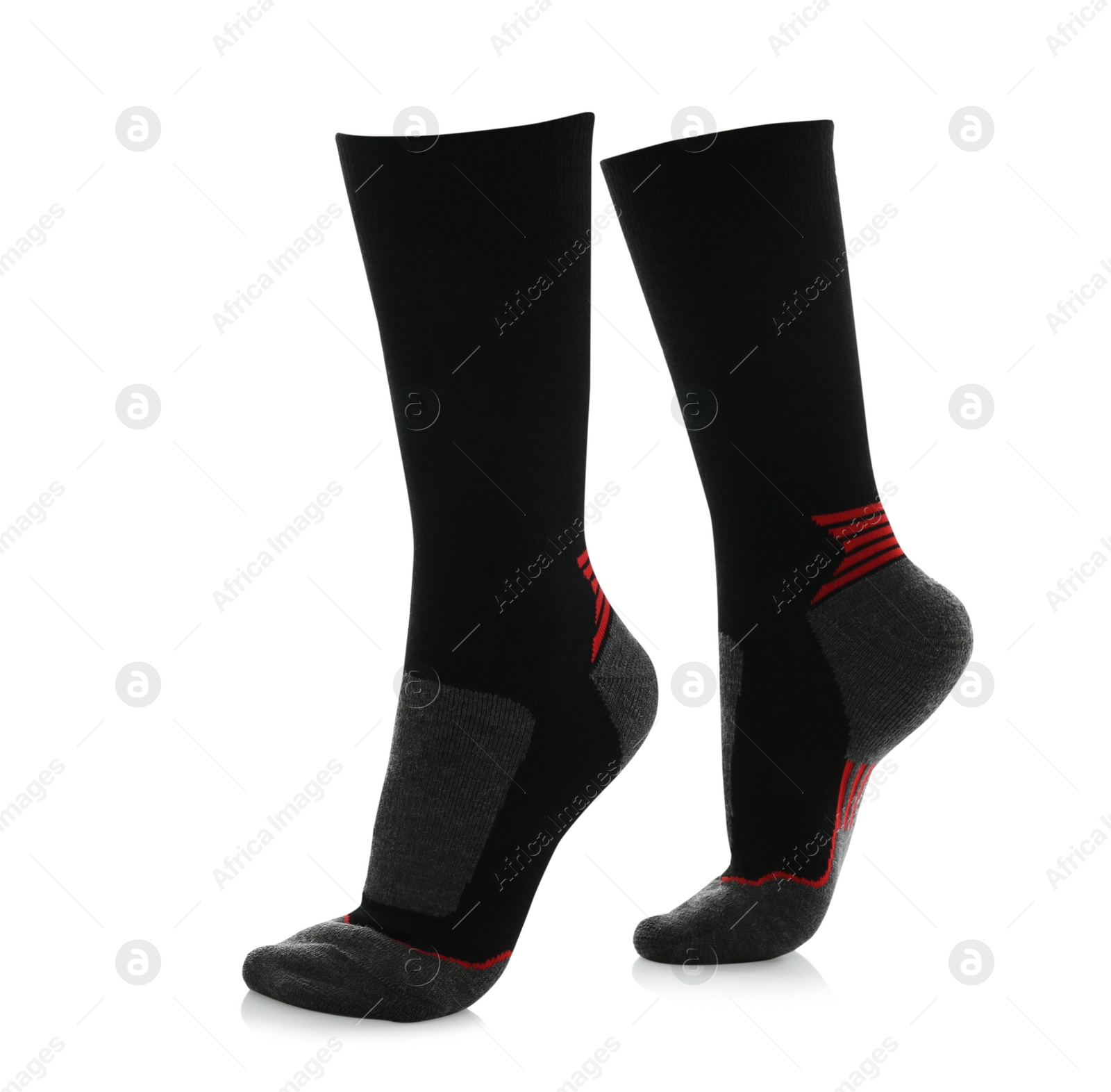 Photo of Woman wearing thermal socks on white background, closeup of legs. Winter sport clothes