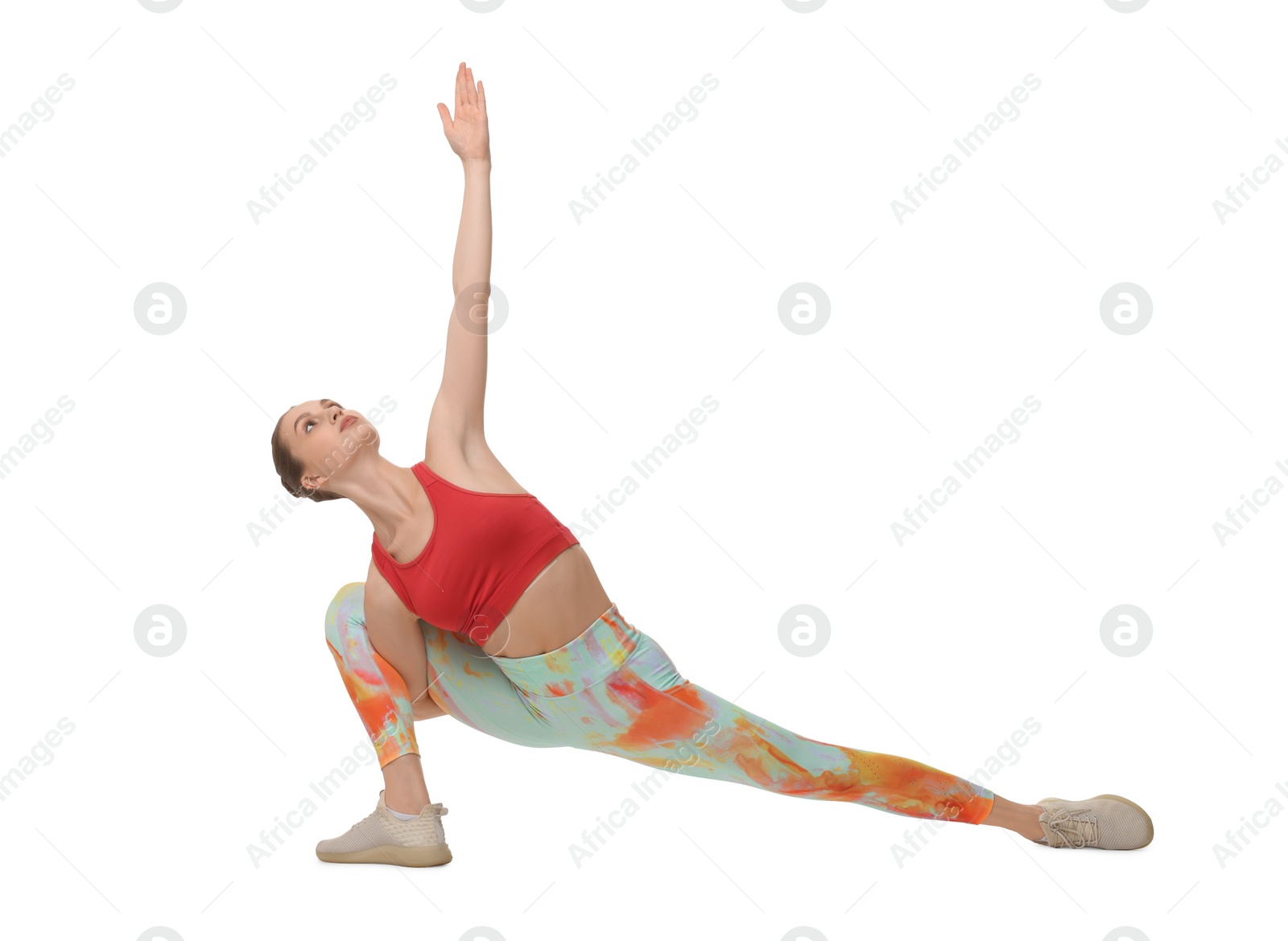 Photo of Yoga workout. Young woman stretching on white background