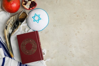 Photo of Flat lay composition with Rosh Hashanah holiday symbols on grey table. Space for text