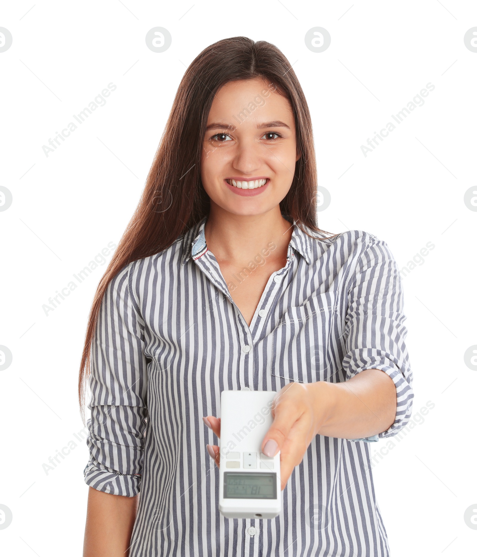 Photo of Happy young woman operating air conditioner with remote control on white background