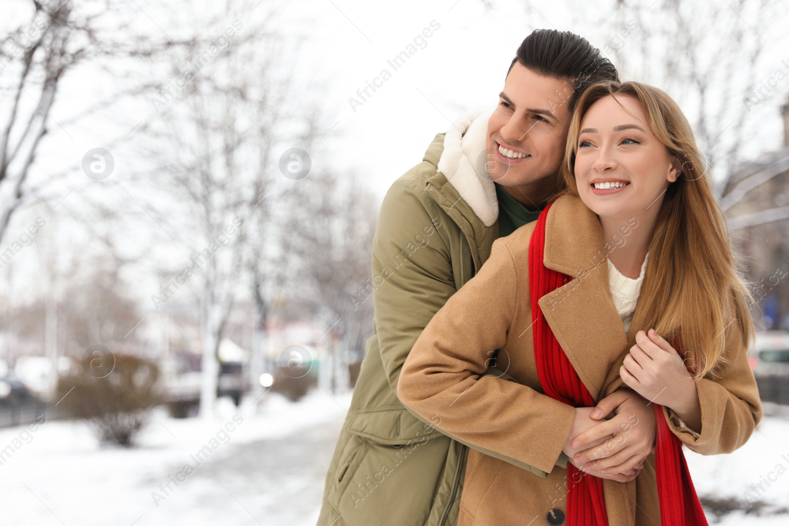 Photo of Beautiful happy couple outdoors on winter day