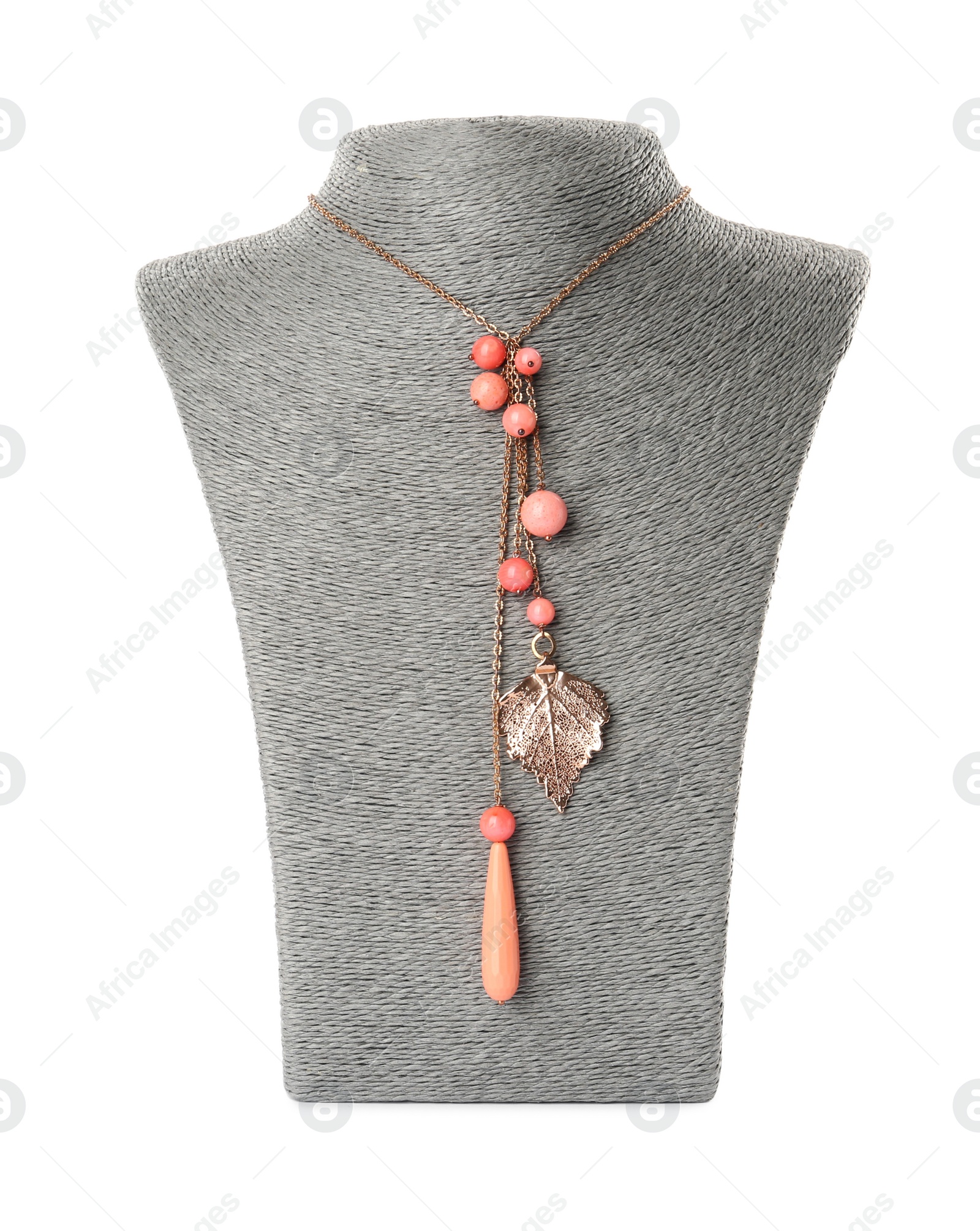 Photo of Stylish necklace with gemstones on jewelry bust against white background