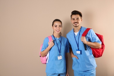 Photo of Young medical students on color background. Space for text