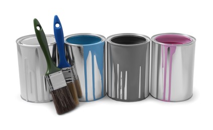 Cans of colorful paints and brushes isolated on white