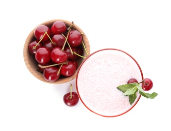 Photo of Tasty fresh milk shake with cherries on white background, top view