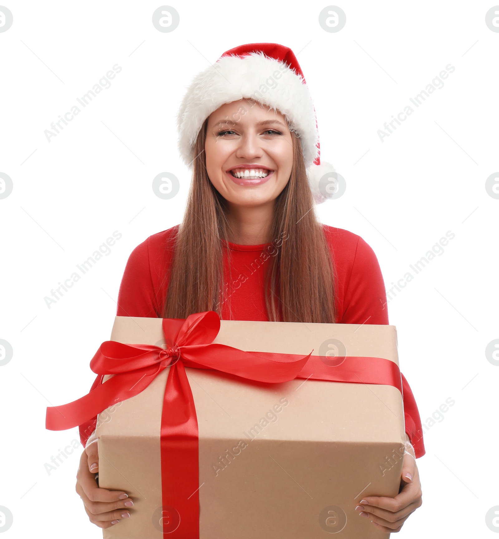 Photo of Happy young woman in Santa hat with Christmas gift on white background