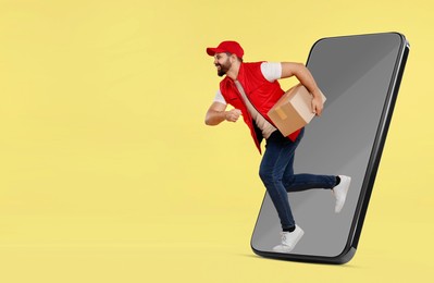 Image of Courier with parcel running out from huge smartphone on light yellow background. Delivery service. Space for text