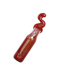 Ketchup and glass bottle isolated on white, top view