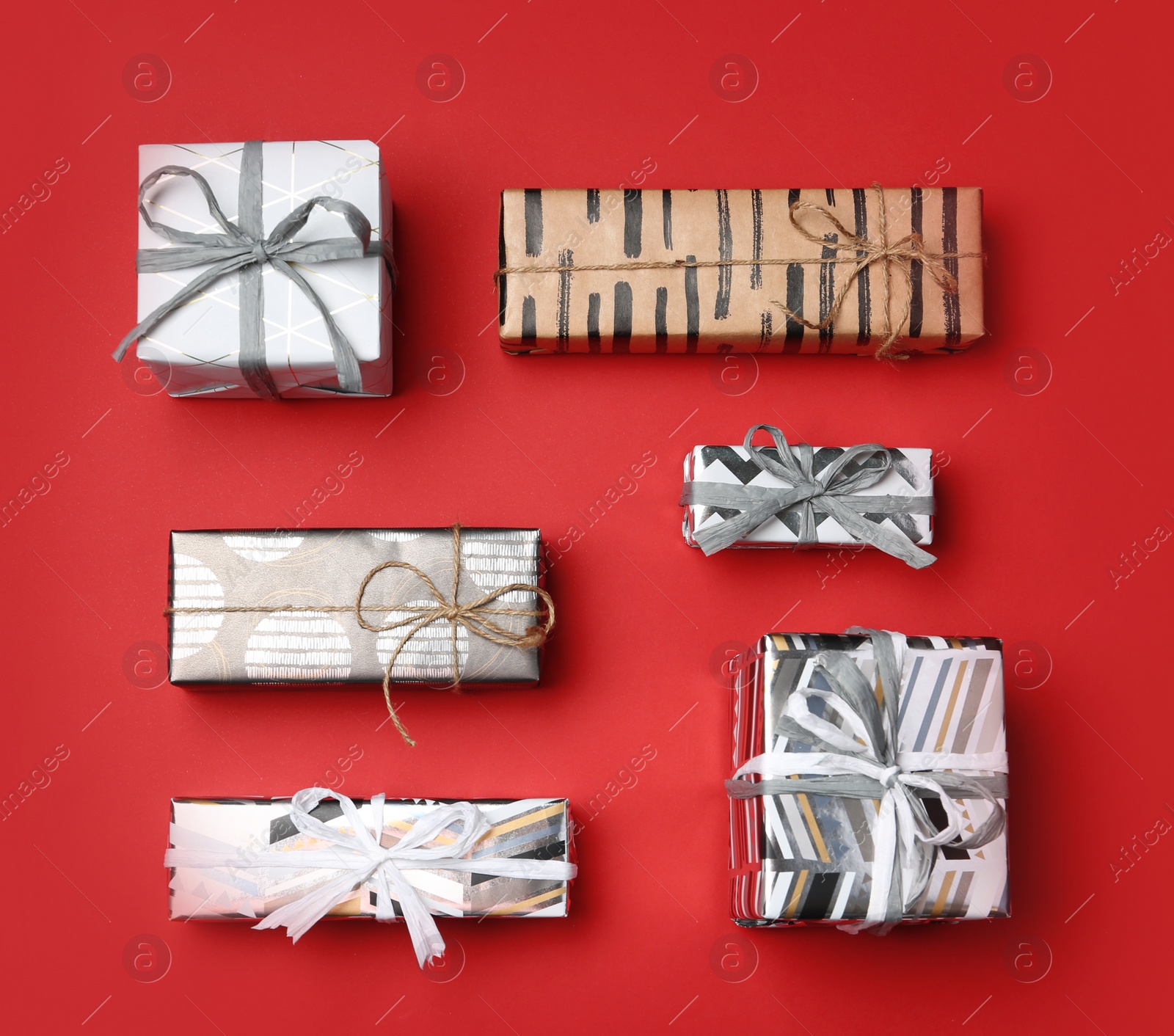 Photo of Flat lay composition with beautiful gift boxes on color background