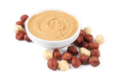 Delicious nut butter and hazelnuts isolated on white