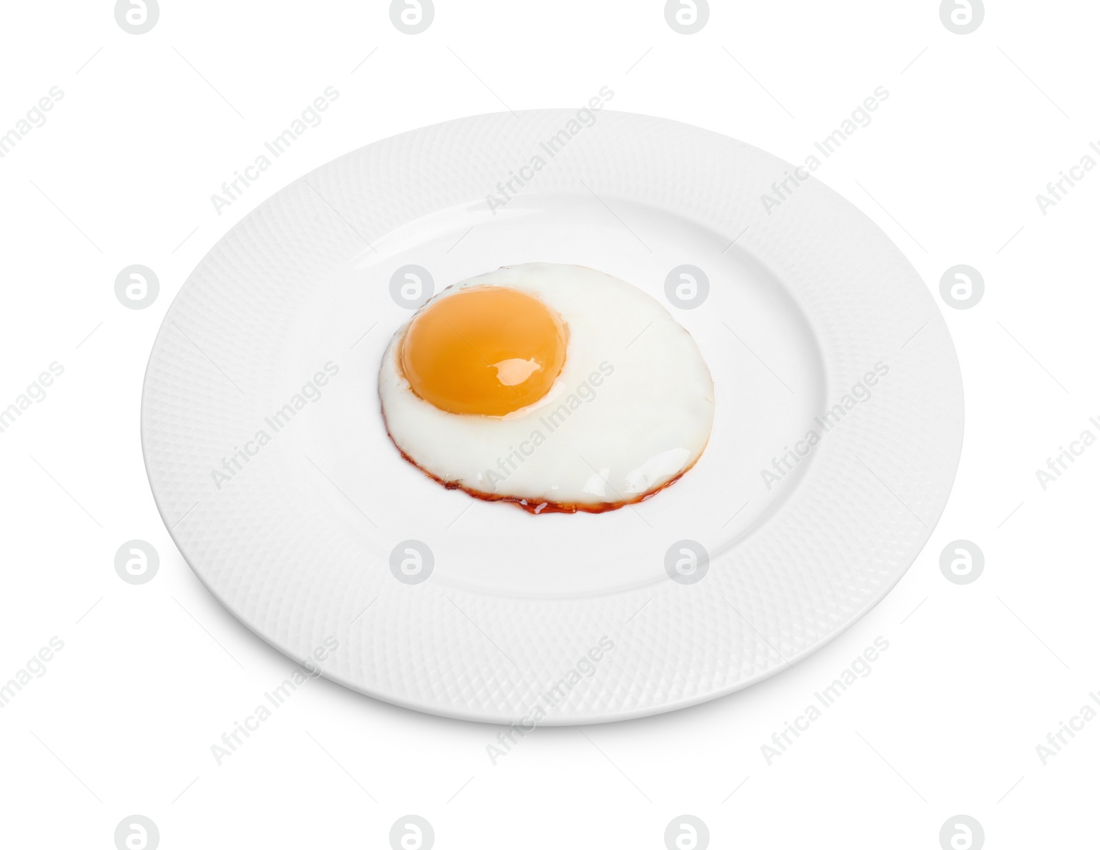 Photo of Plate with delicious fried egg isolated on white