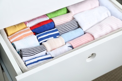 Photo of Wardrobe drawer with many child socks, closeup